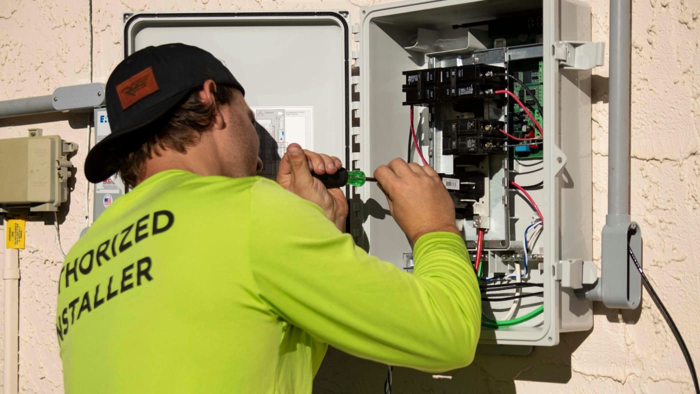 An open electrical panel with labeled breakers.